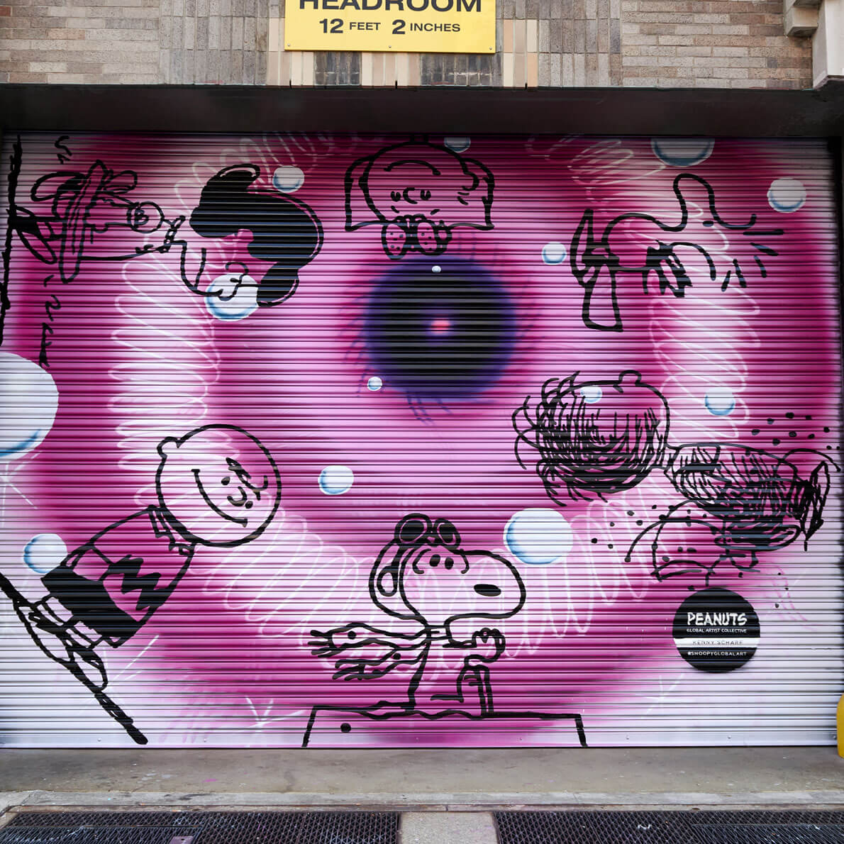 A spray painted, purple eye with show characters around it. 