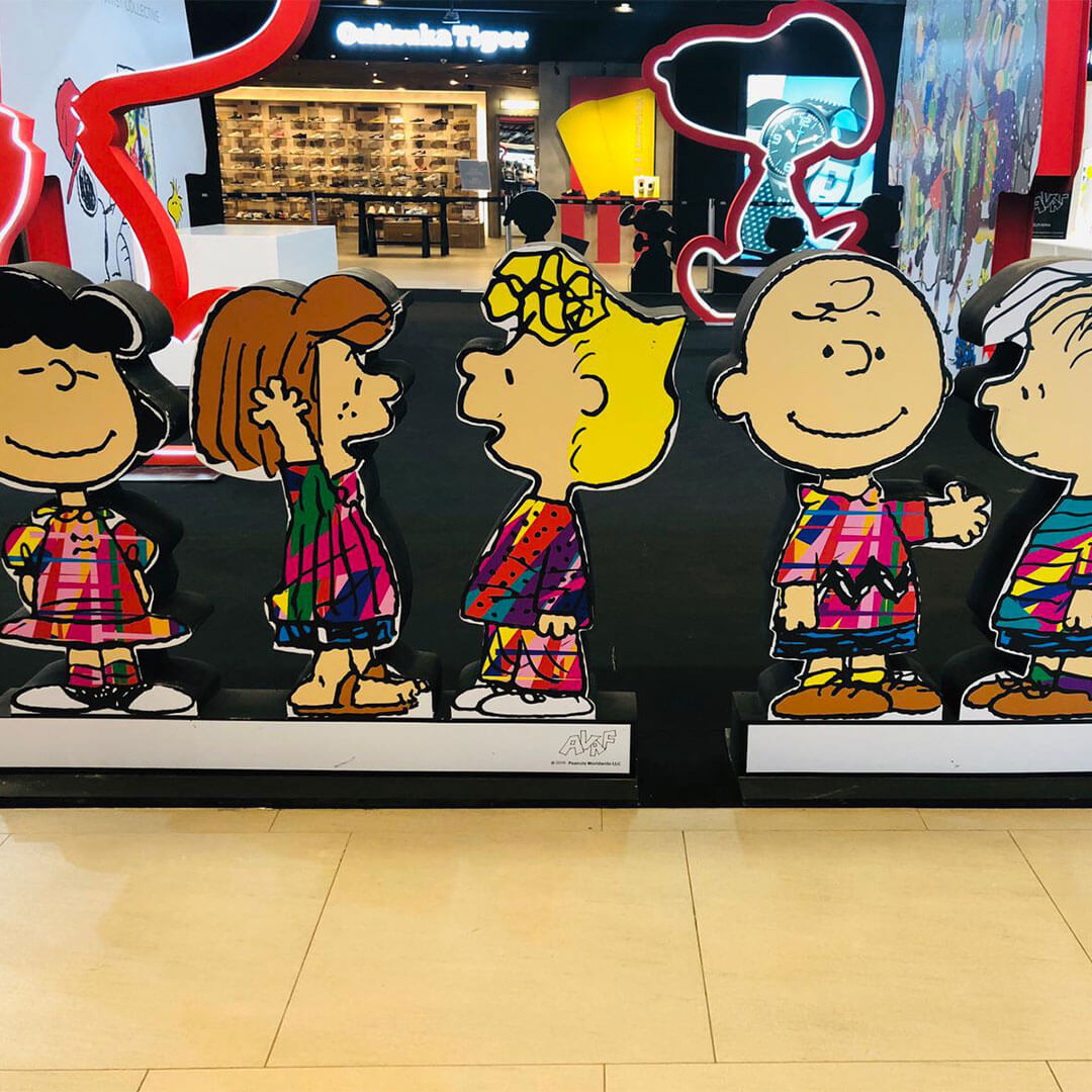 An art installation inside a mall of five cartoon characters.