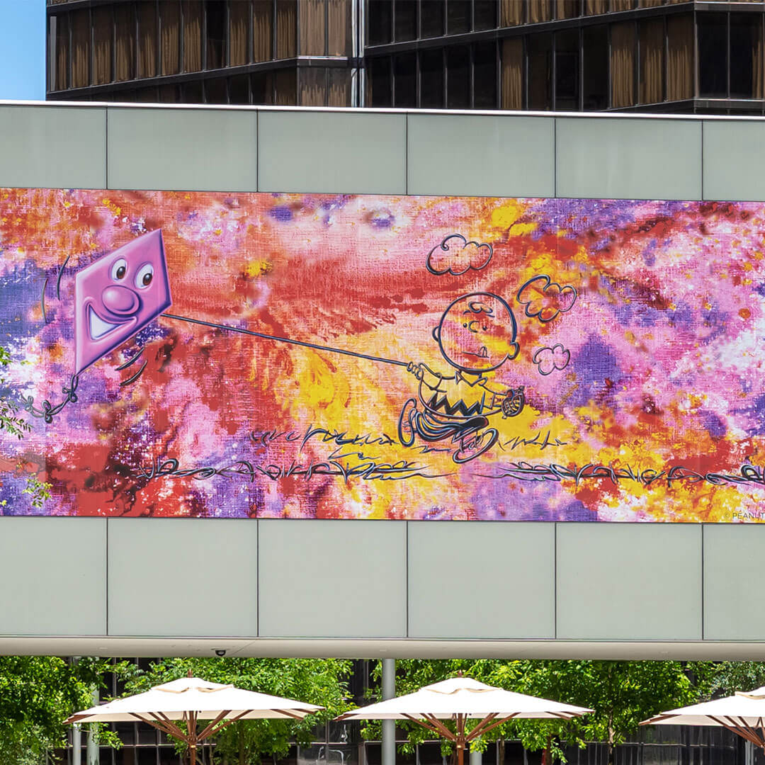 A close-up of a large mural on the side of a building.