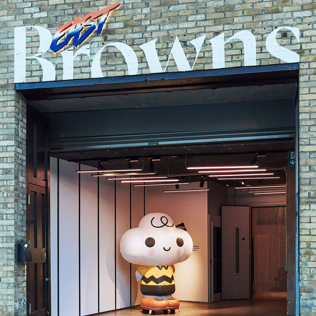 A blow-up statue inside of a brown brick building.