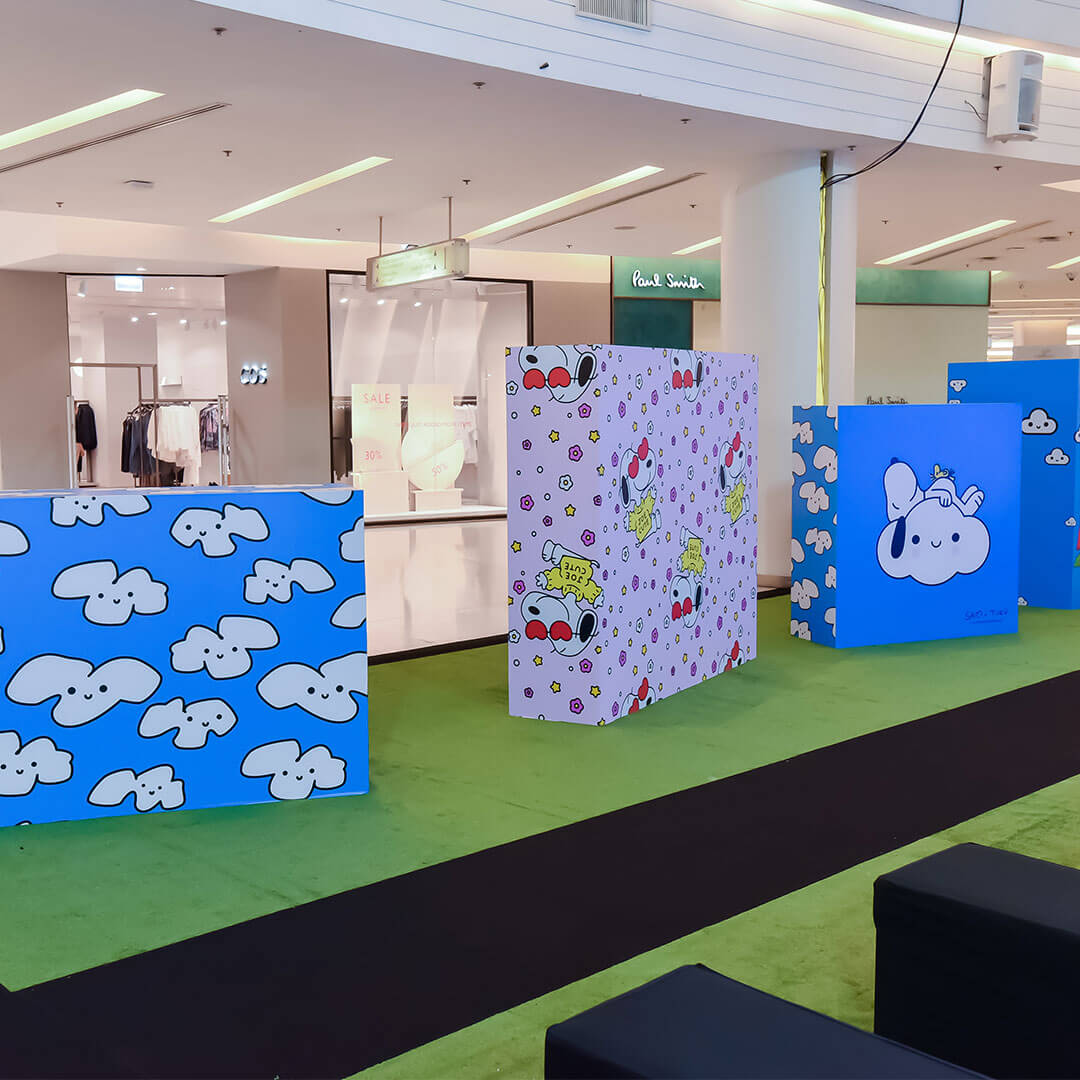 Colourful, three dimensional boxes on the floor in an indoor space.