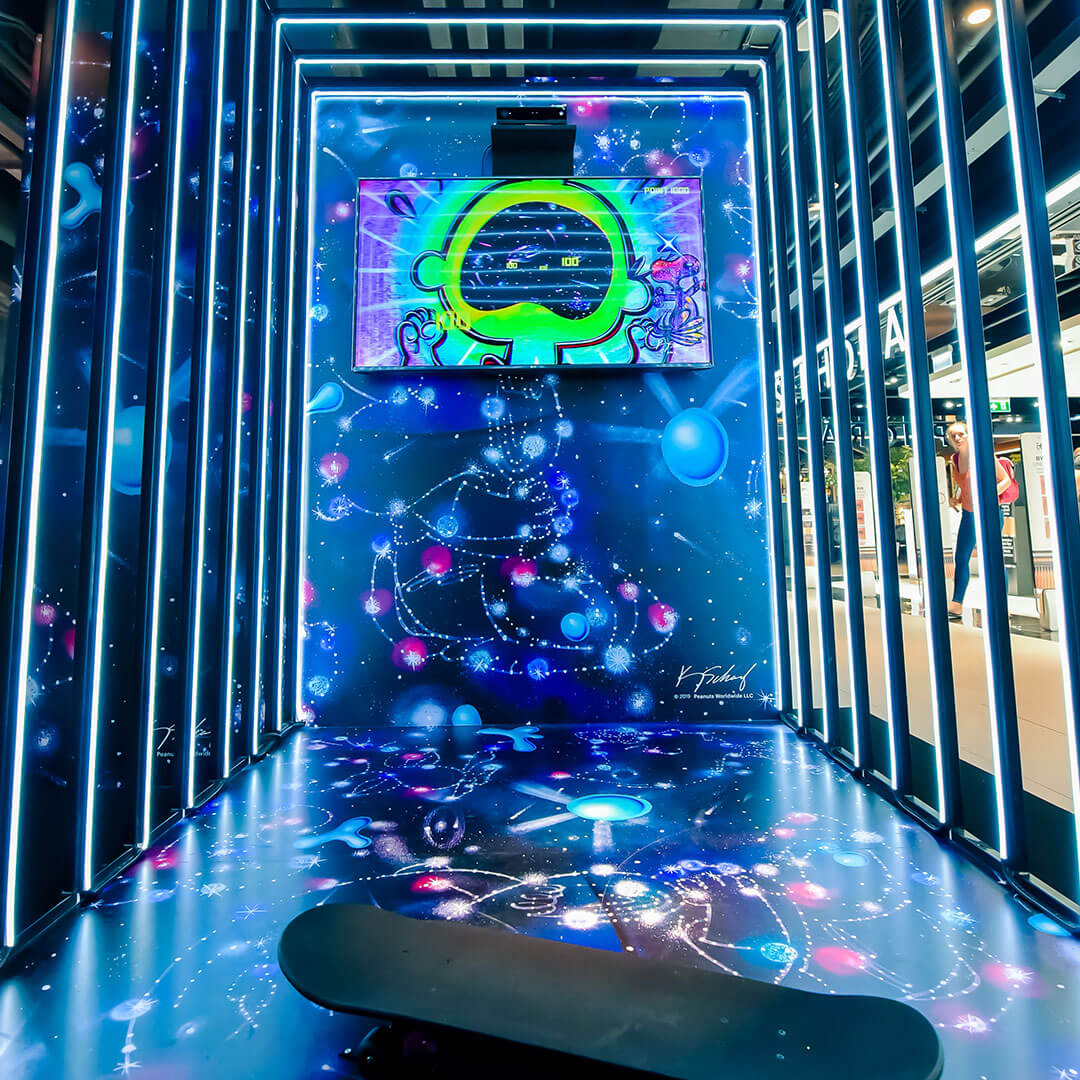 An indoor space with a galaxy-themed art installation.